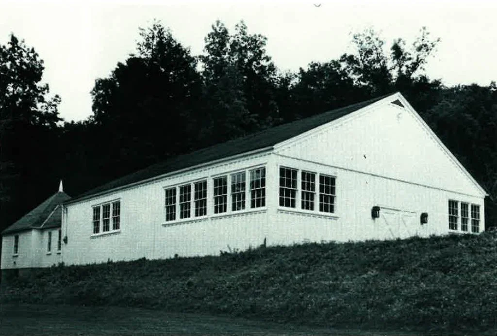 The riding barn before its transformation into Herter Hall.