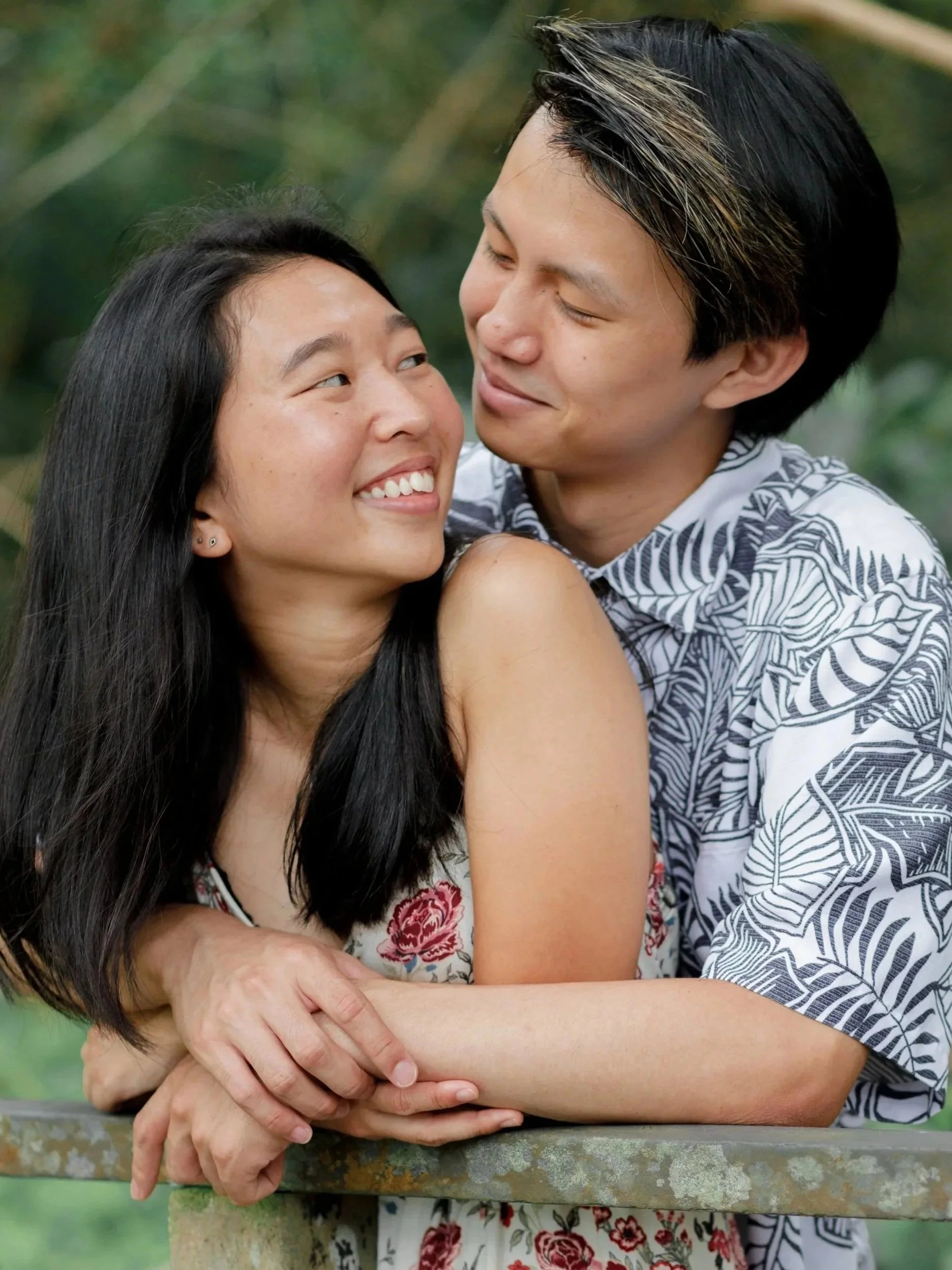 Outdoor couples portrait of a couple embracing in natural light