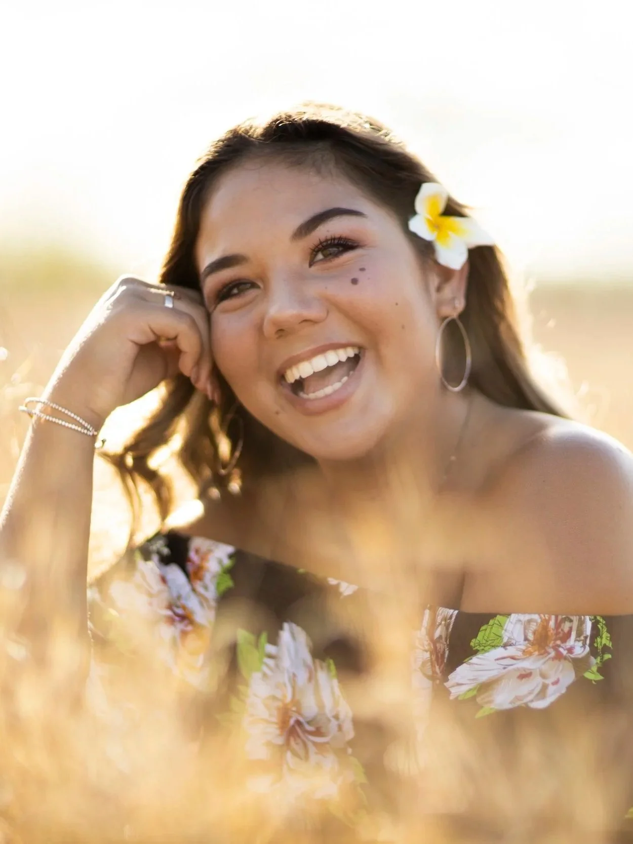 Golden hour graduation portrait of a woman outdoors in natural light