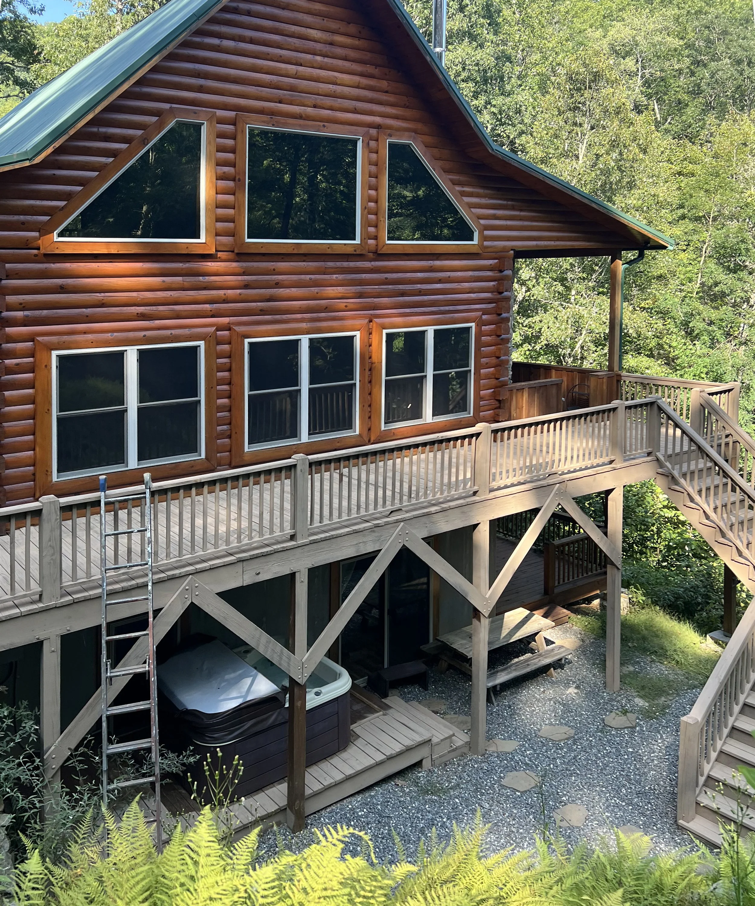 deck and stairs of log house, before staining