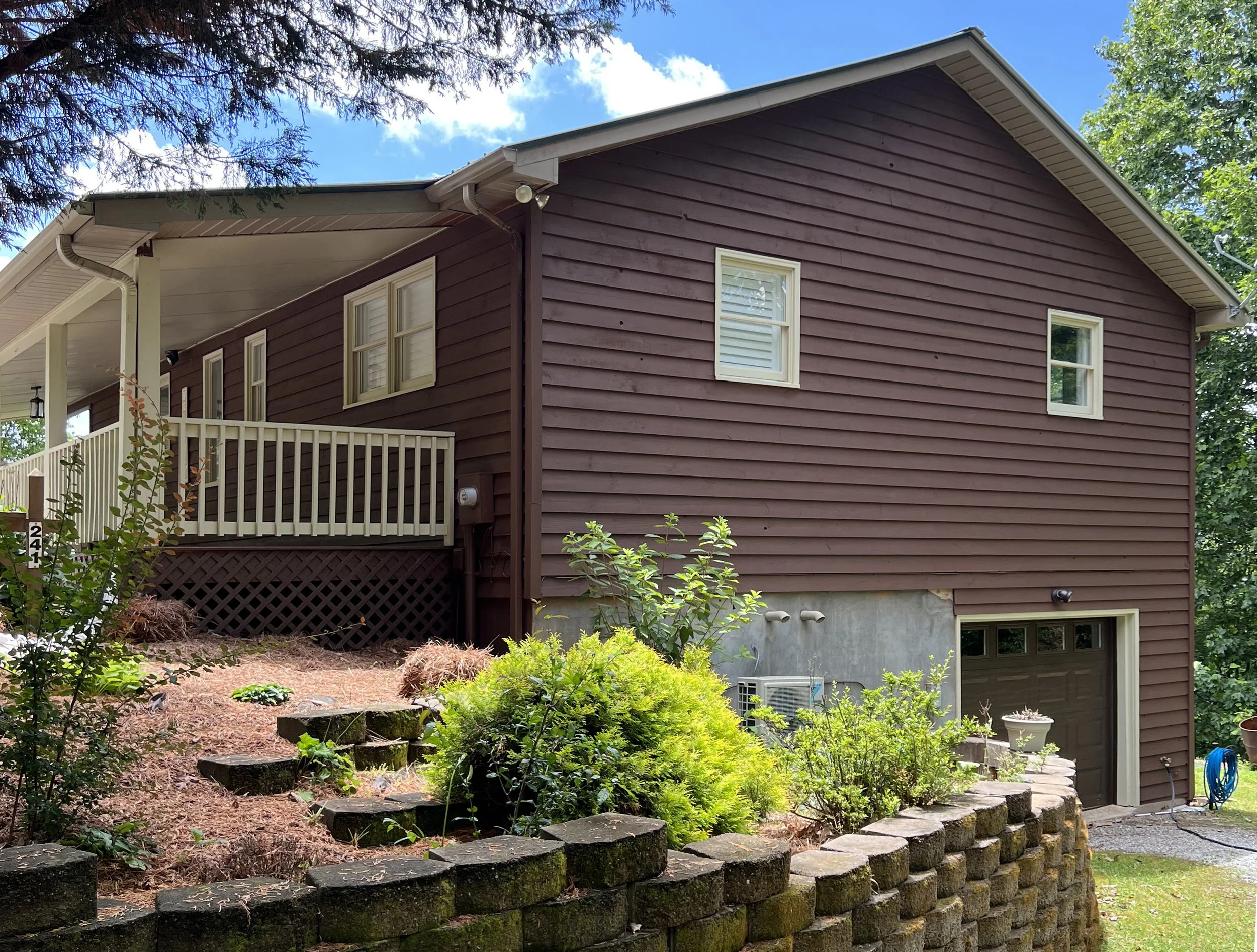 2-story wood-sided house after painting siding and trim