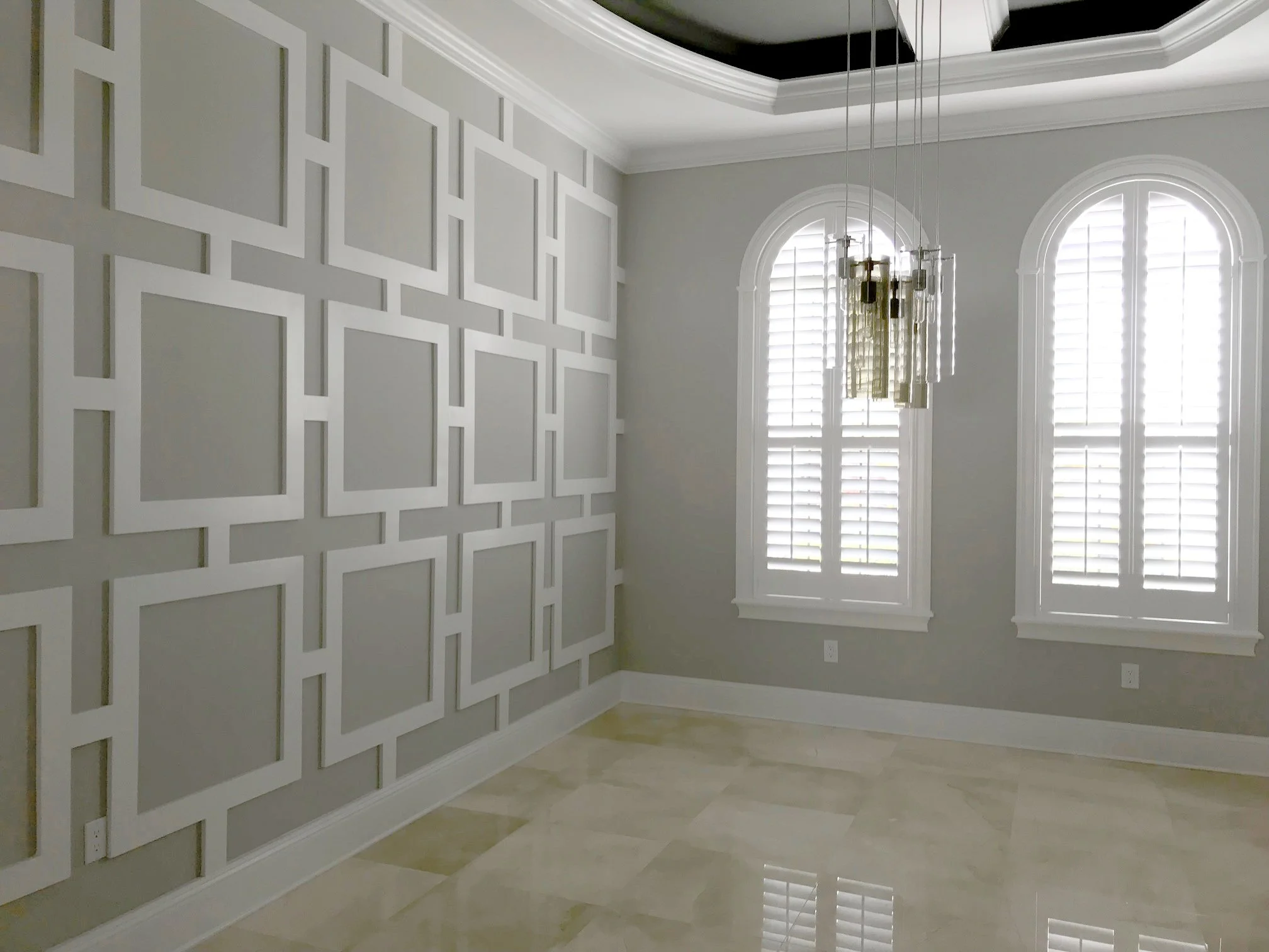 Formal dining area with two-tone greys.