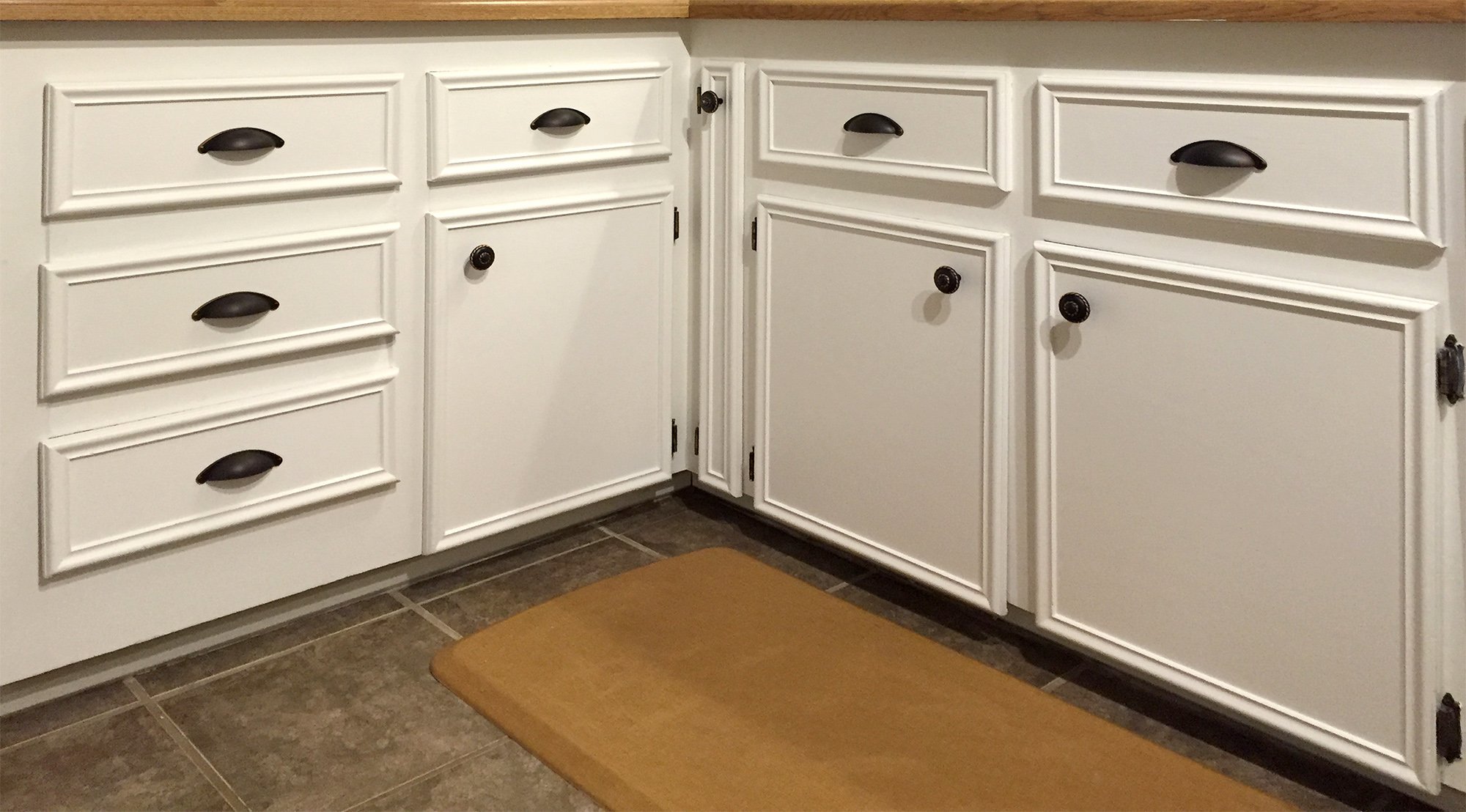 Fresh paint and new hardware to brighten this kitchen.