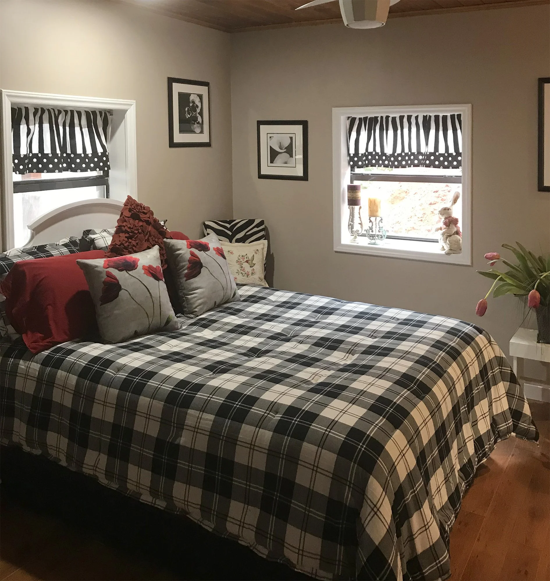 Warm grey walls complete a modern look for this cozy guest bedroom.