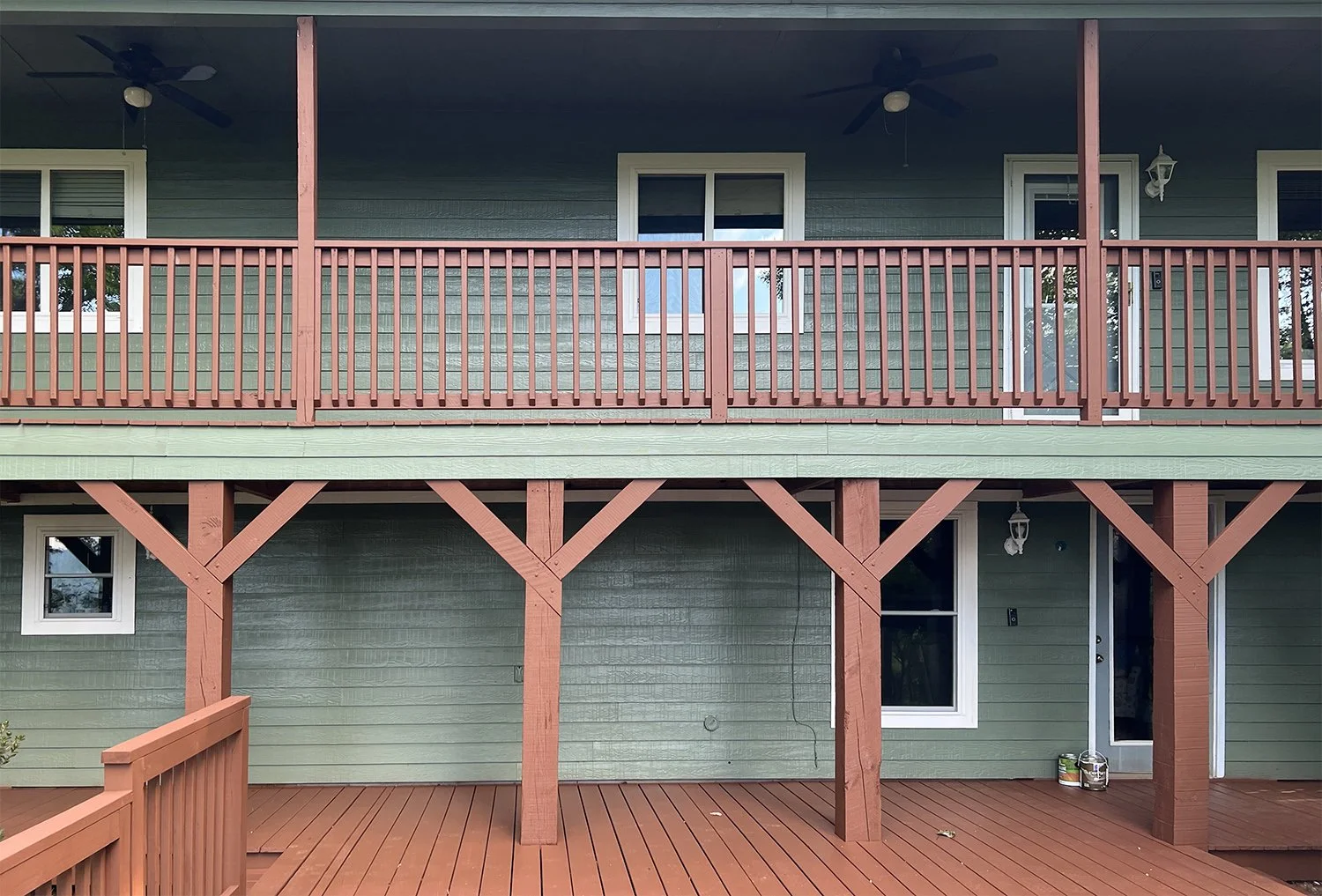 Washed and painted siding, trim and solid-body stained the the raw pressure-treated wood decking. Franklin, NC