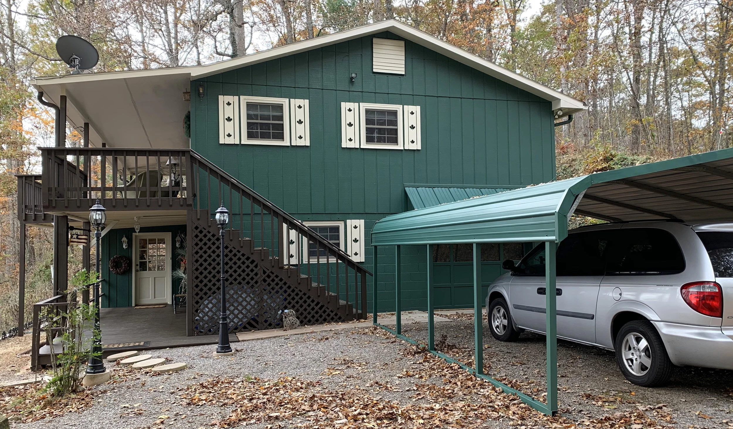 Sharp's Painting, LLC, WNC: cabin and carport in hunter green with accented decorative shutters