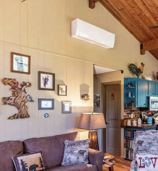 This small 2-bedroom cabin had dark panelling throughout. We used warm beige to make it appear larger and light-infused.
