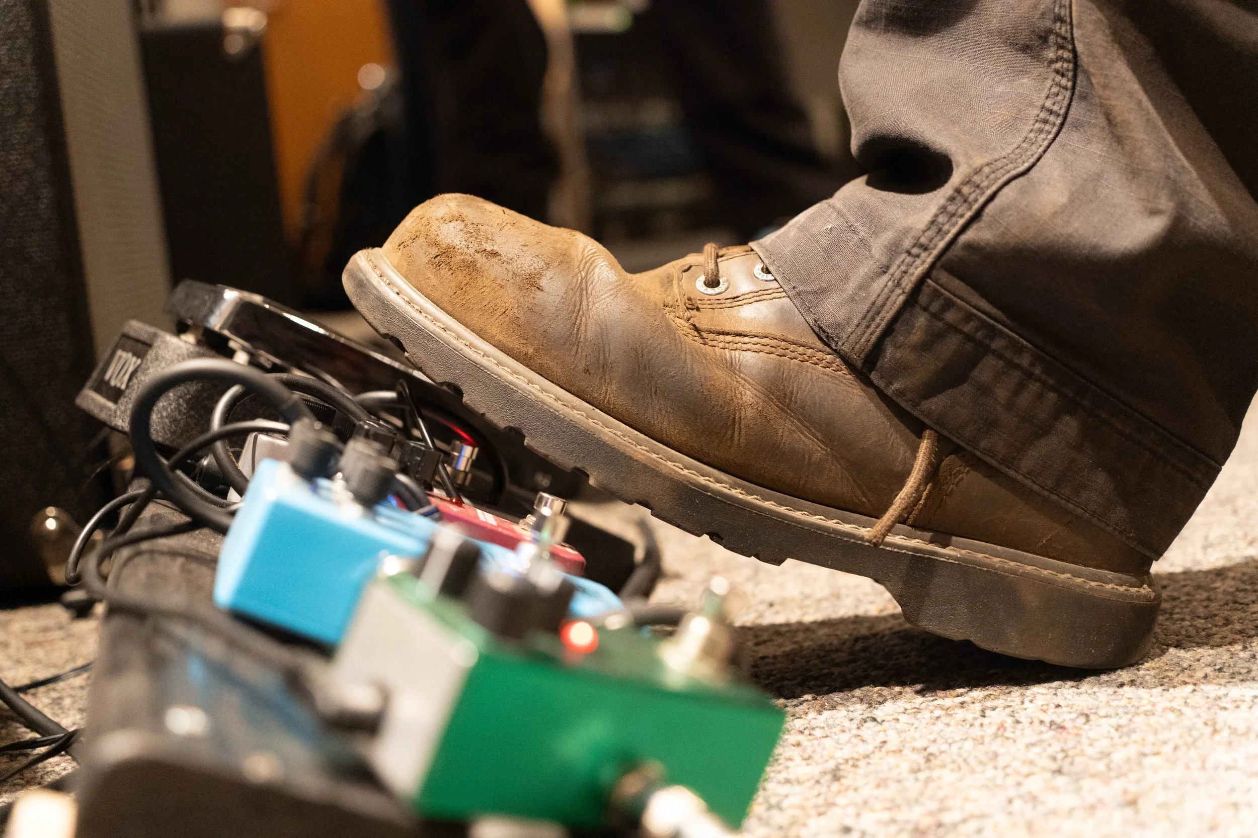 Guitarist Liam Neiwert's boot on one of his guitar pedals during False Start's practice and recording session in Ferguson Hall at the University of Minnesota in Minneapolis, Minn., on Nov. 24, 2025. Neiwert was invited to join the band by bassist Pau