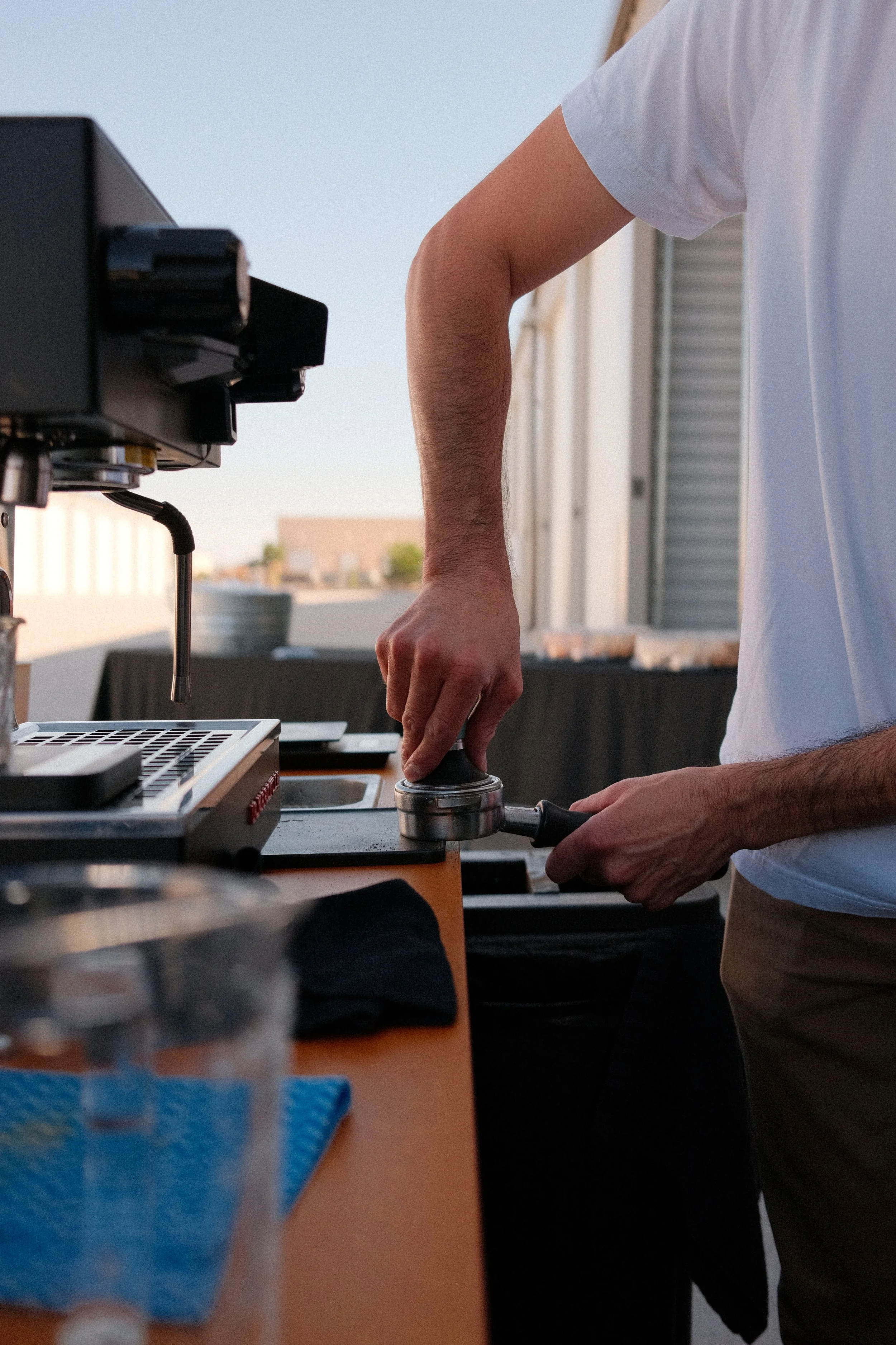 Pressing down on ground espresso for brand integration Luxelocker