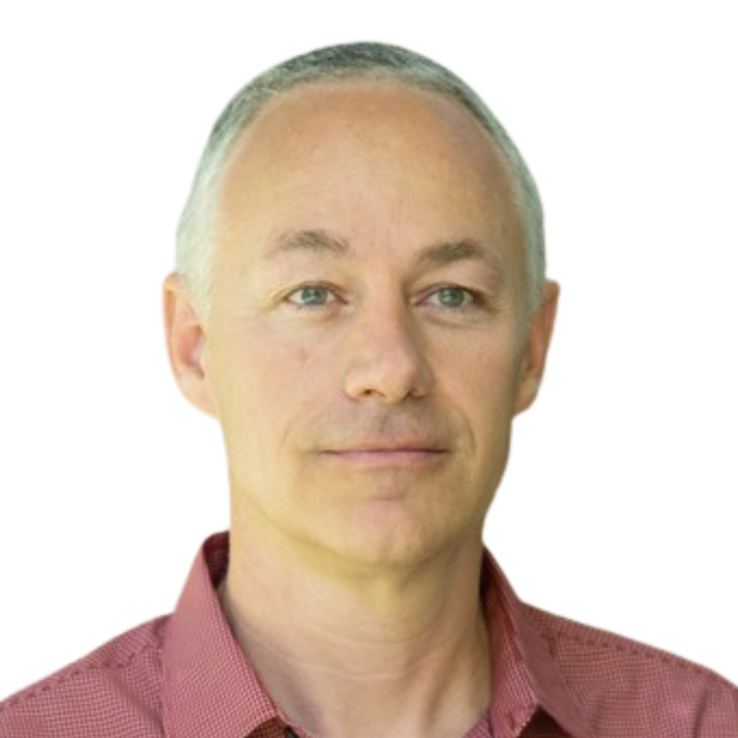 Close-up of a middle-aged man with short gray hair, blue eyes, and light skin, wearing a red collared shirt.