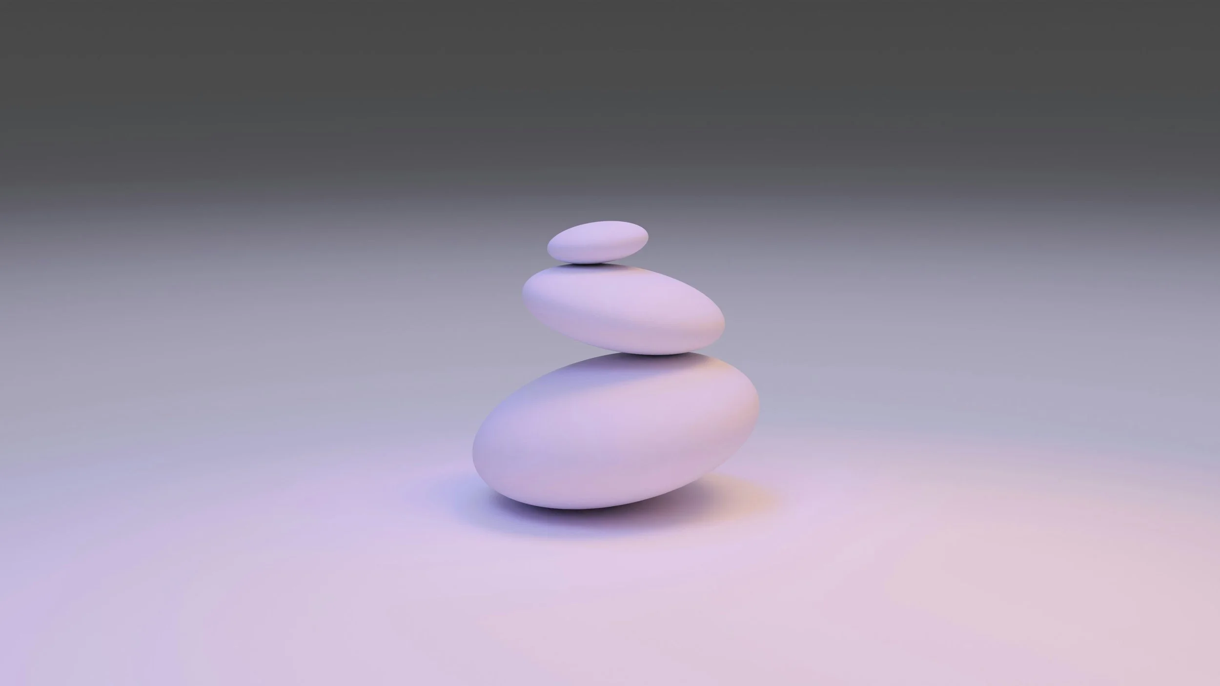Stones balancing in harmony, representing how integrative therapy works to balance change with acceptance