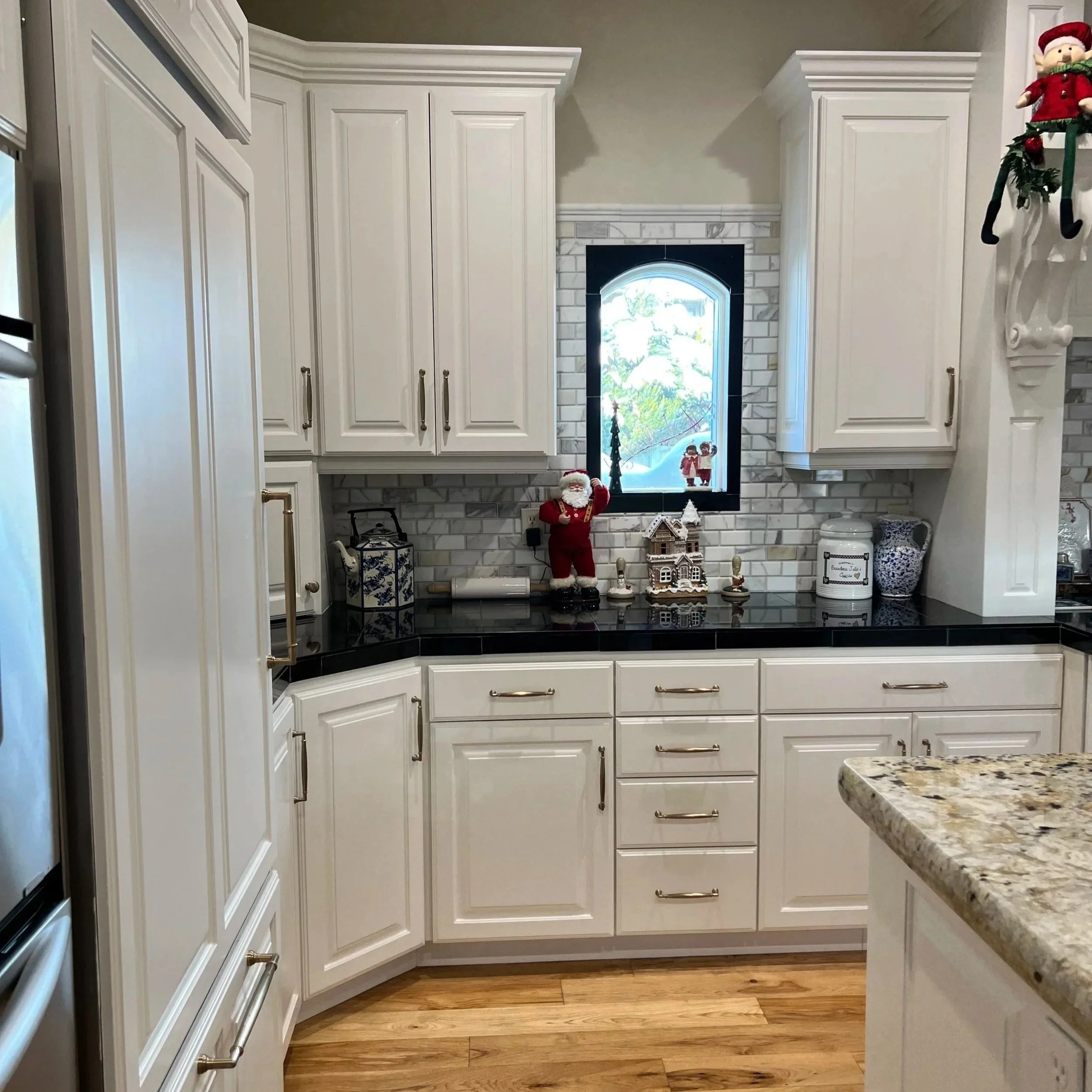 kitchen backsplash, counter, cabinets and flooring