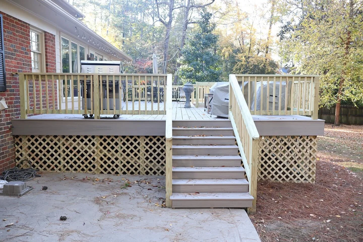 Check out this awesome new deck we just wrapped up! We topped it off with Trex composite decking &mdash; super durable, long-lasting, and way easier to take care of than regular wood. Did I mention it was 100% inspected and approved by local inspecti