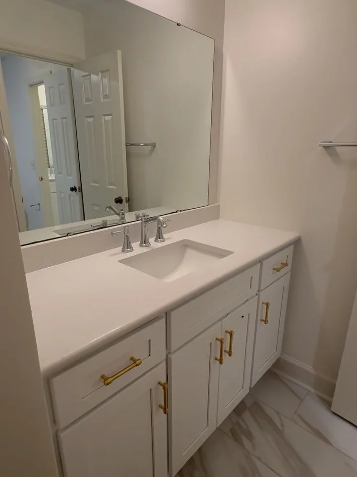Timeless updates with clean lines and fresh finishes. Both bathrooms feature complete renovations with new tile, fixtures, paint, and modern design details throughout. Ready to transform your space? Call us today!
910.703.1991