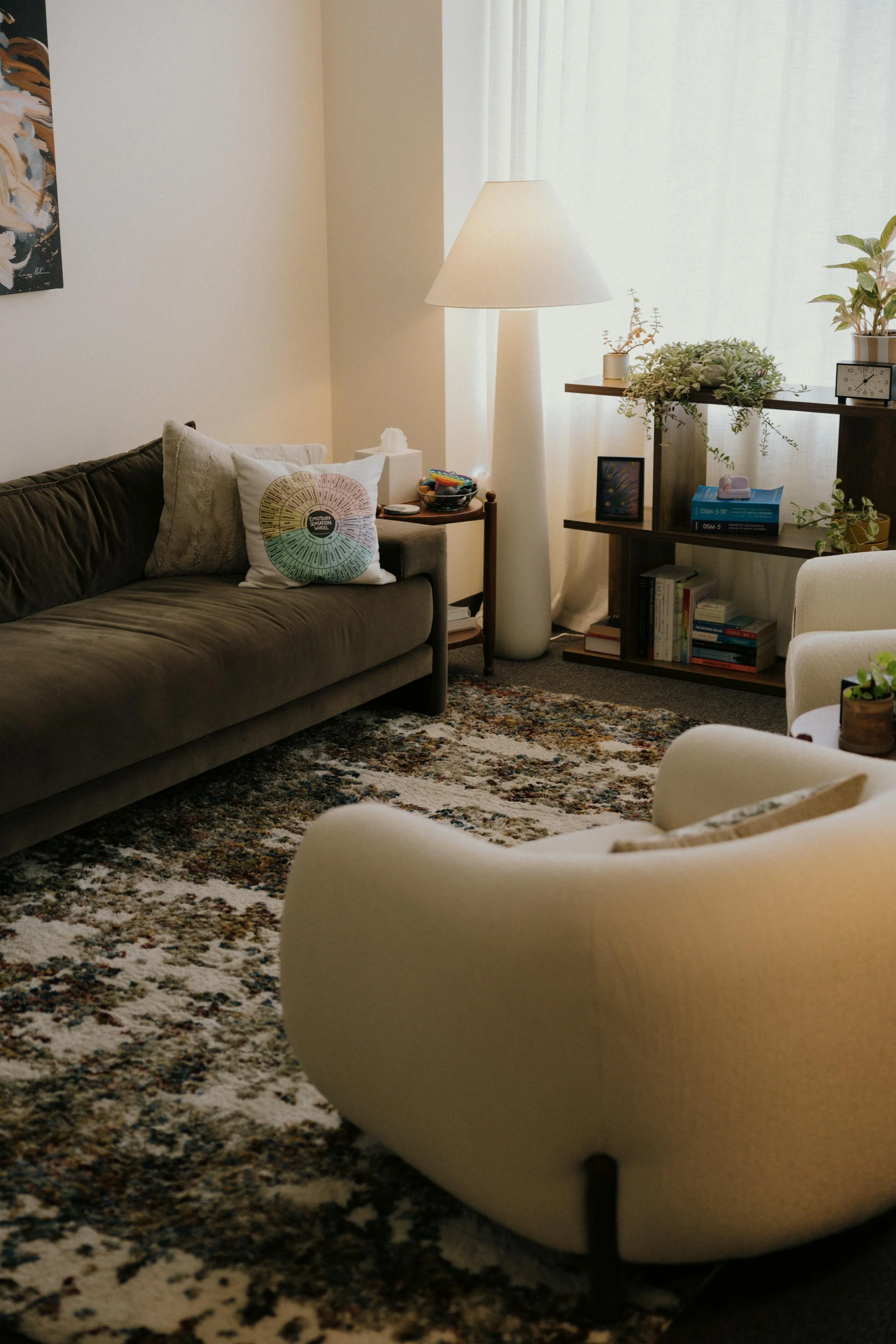 Warm and welcoming therapy office with natural lighting and plants