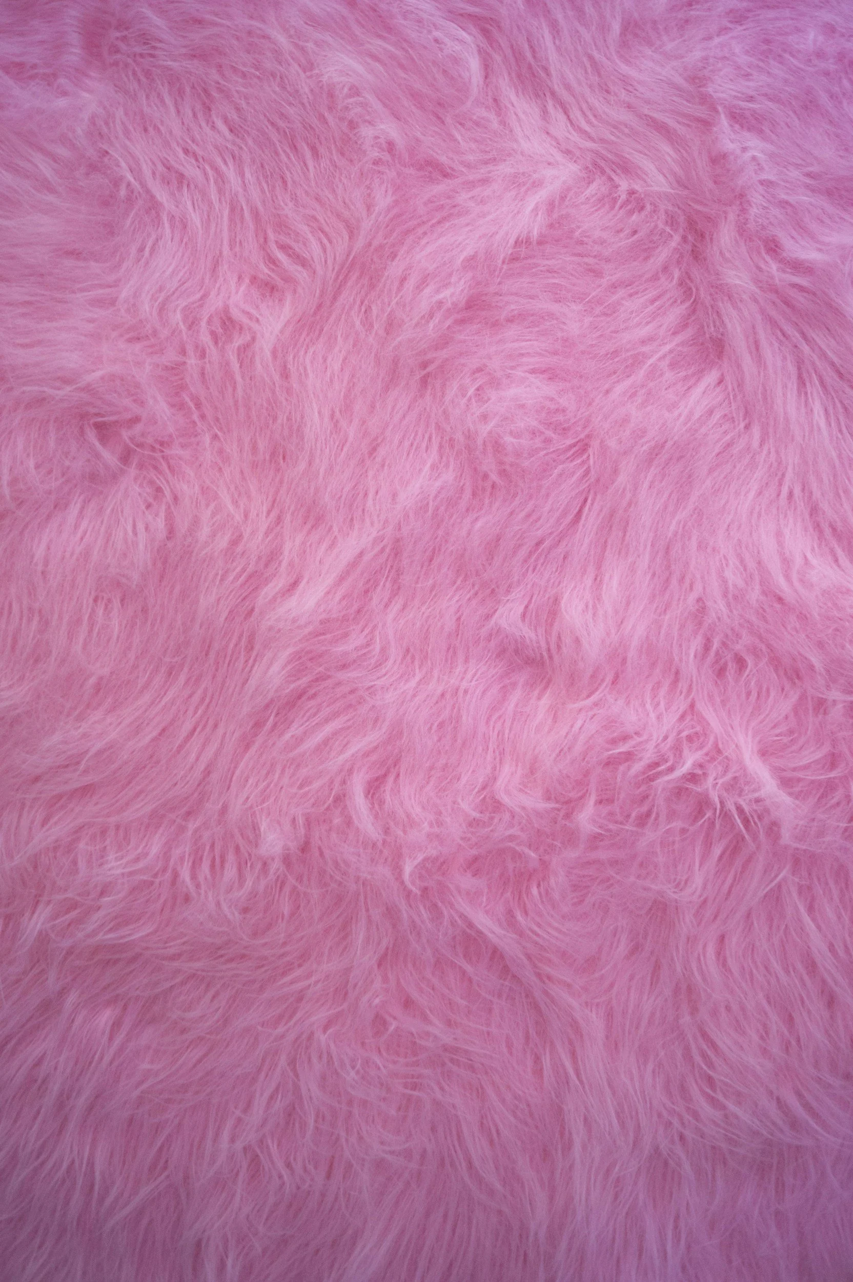 Close-up of pink faux fur fabric.