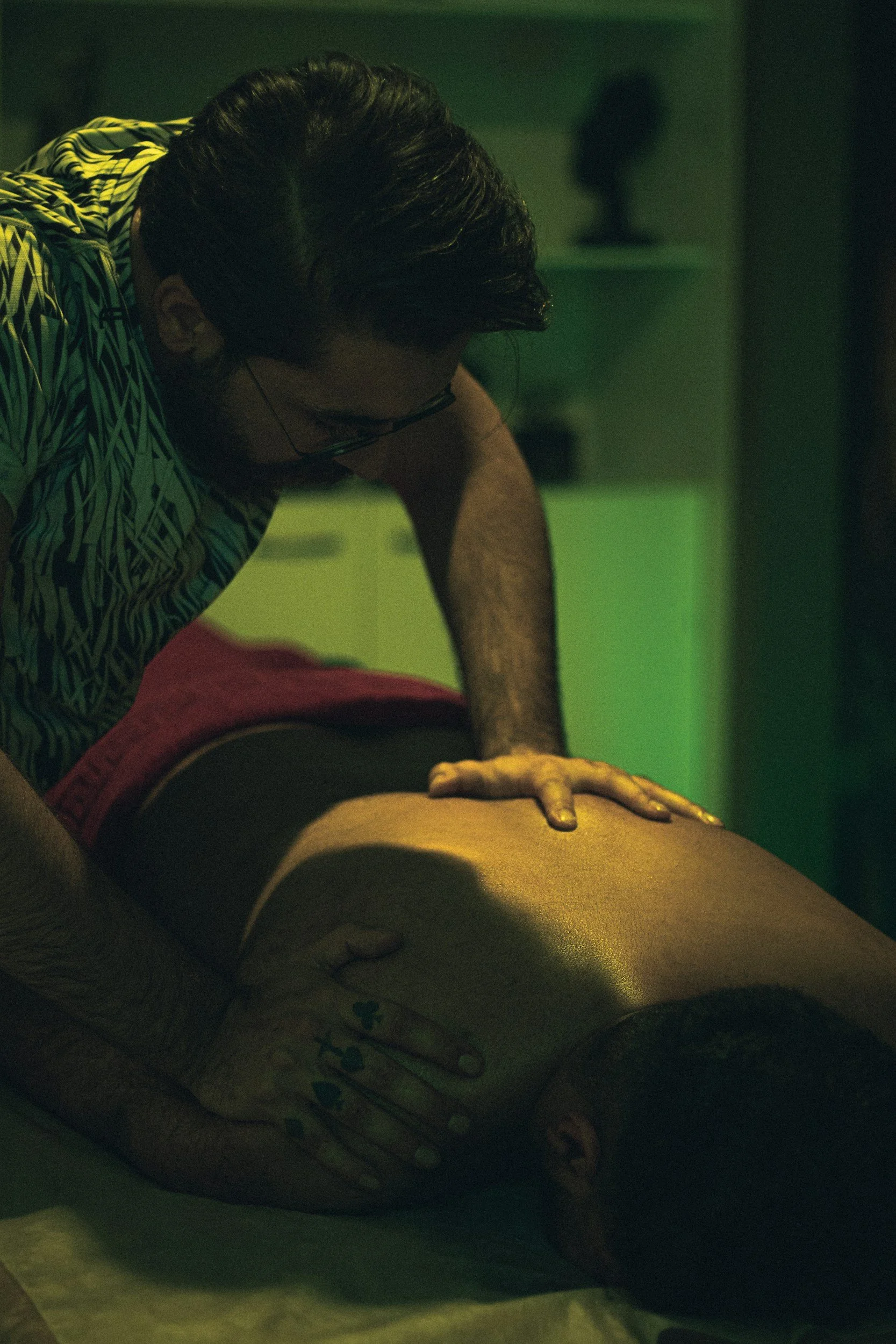Man massaging another man