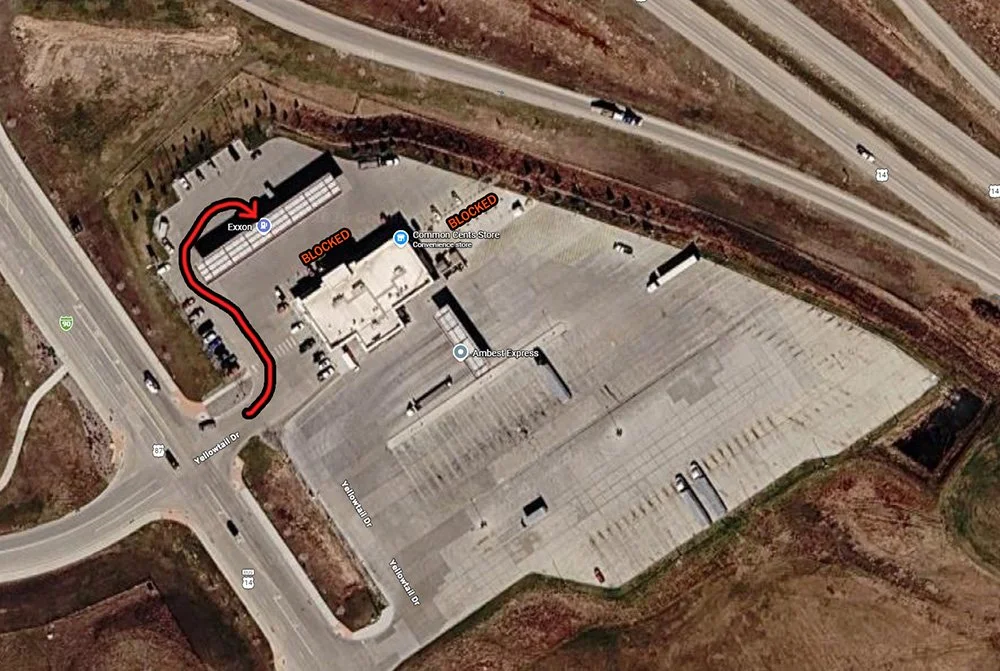 A Google Maps photo of a gas station and arrows signifying the path the RV must take for a perpendicular fuel pump station.