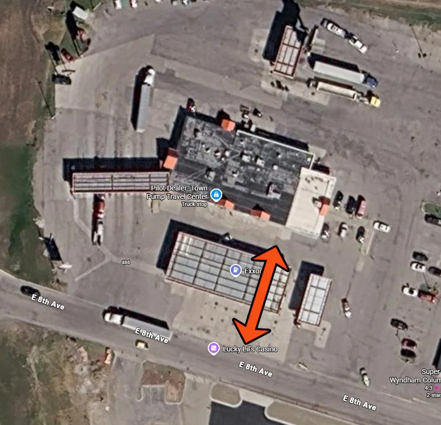 A Google Maps photo of a gas station and arrows signifying the path the RV must take for a perpendicular fuel pump station where you have to directly back out..
