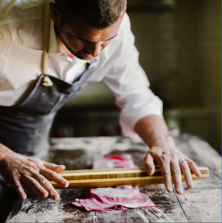 Geometric drawing of an outline square with sections divided by vertical, horizontal, and diagonal lines.