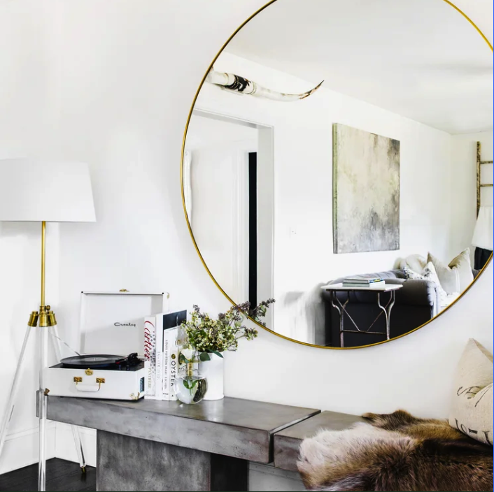 Geometric drawing of an outline square with sections divided by vertical, horizontal, and half circle lines.