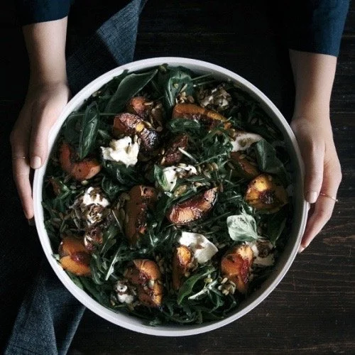 Geometric drawing of an outline square with sections divided by vertical, horizontal, and diagonal lines.