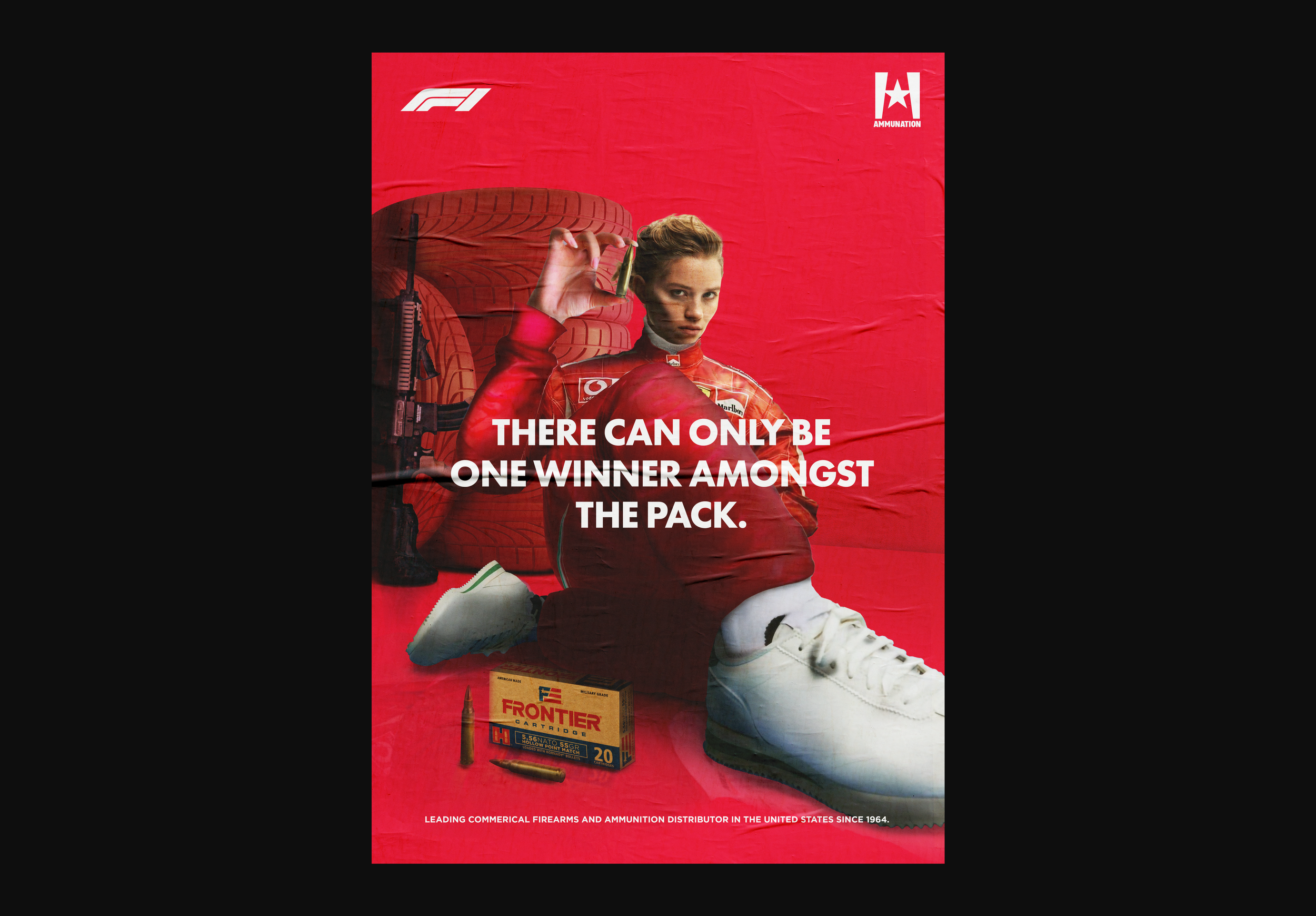 Red background with a young woman in a racing suit sitting among car tires, holding a bullet near her face. Text overlay says, 'There can only be one winner amongst the pack.' A box of ammunition and bullets are at her feet. Logos include F1, Ammunit