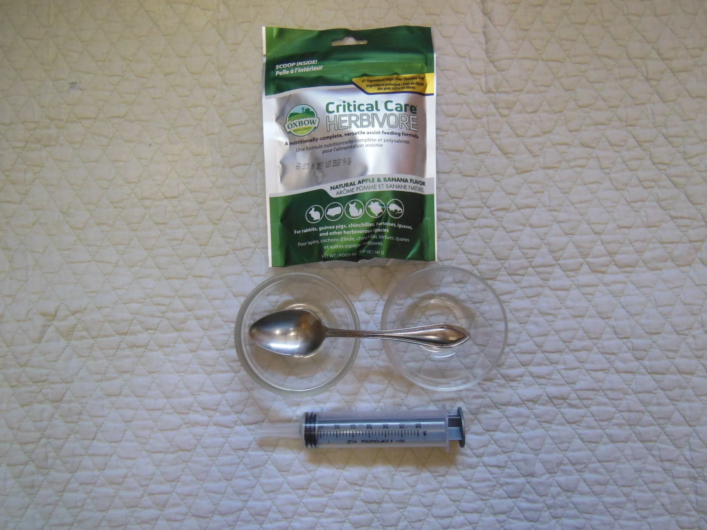 We have an unopened and unexpired bag of Oxbow Critical Care available in our medical supplies. We also have the syringe and mixing bowl used to prepare the Critical Care. We keep a larger bag in our freezer for storage.