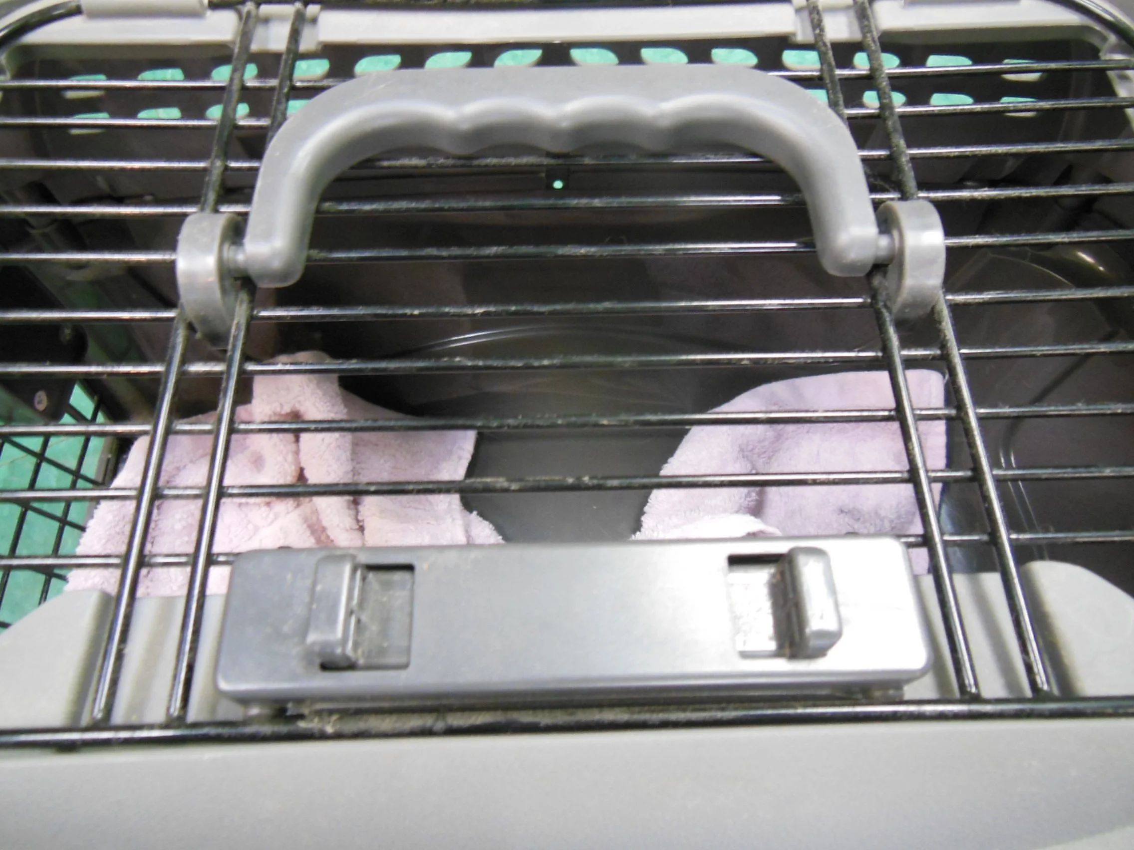 top opending carrier review showing handle and lock