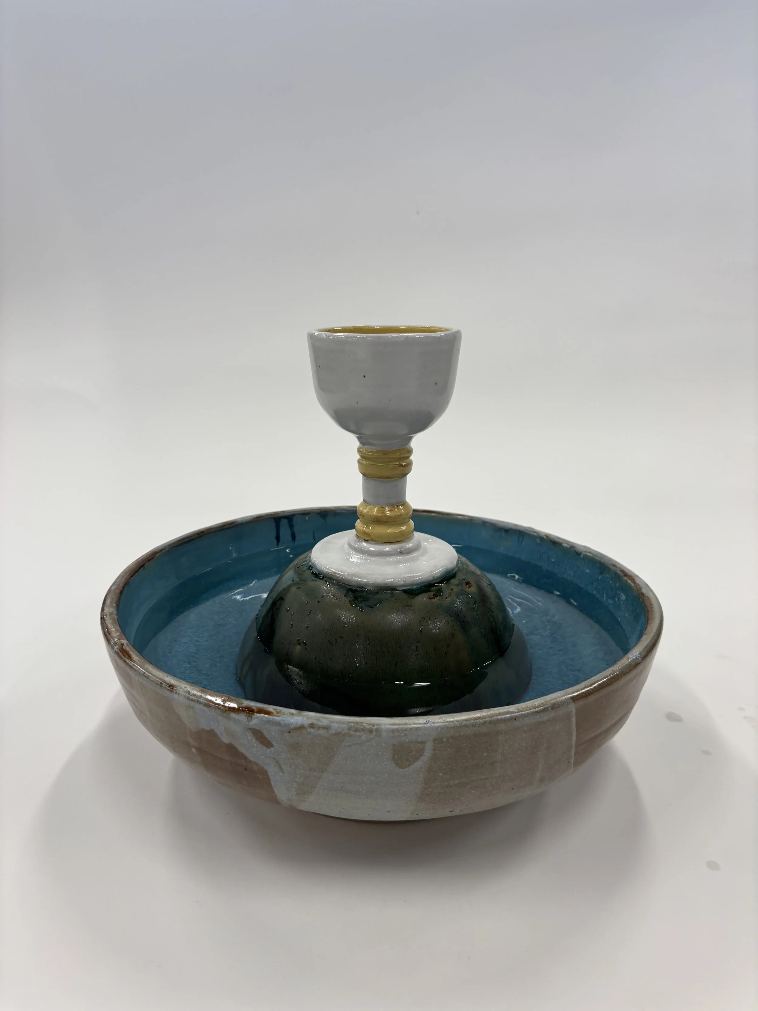 "My Cup Runneth Over," 2026, ceramic, water fountain pump, 11H x 14W x 14D in.