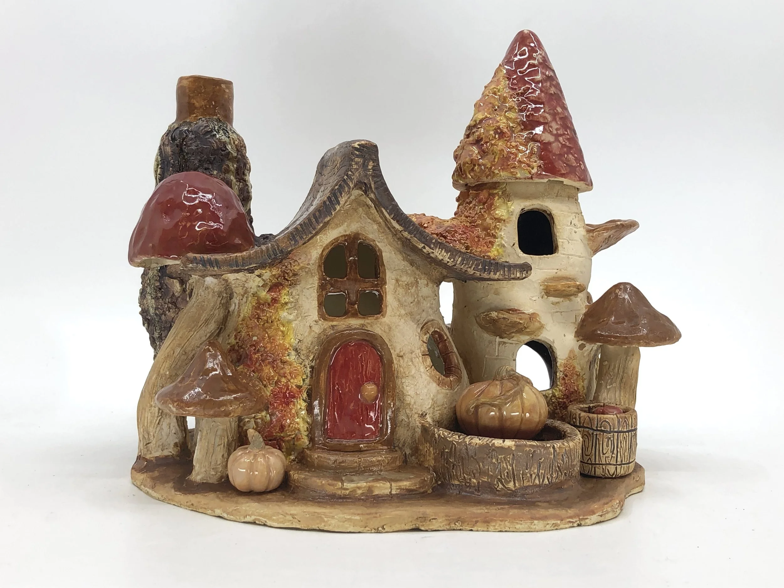 “Mushroom Cottage,”
2023,
ceramic, underglaze, glaze,
8 ¼ x 9 x 7 in.
