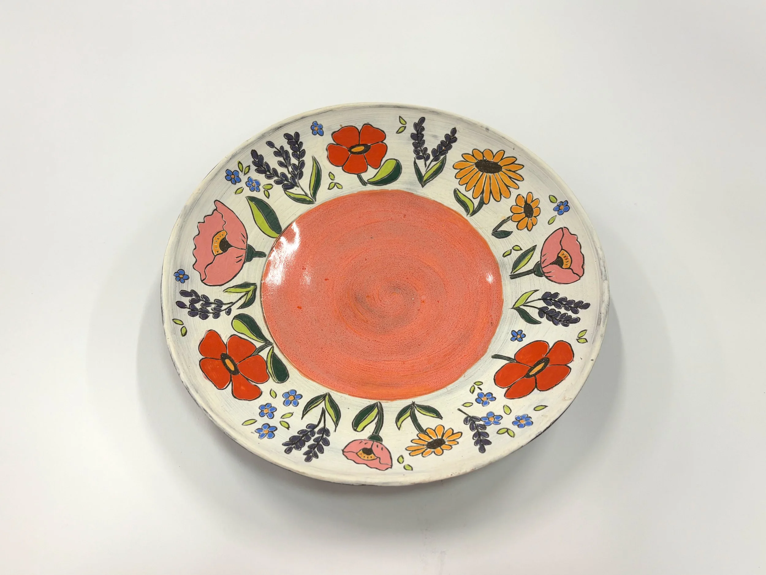 "Wildflower Plate," 2025, stoneware, slip, underglaze, glaze, 8 ¾ x 8 ¾ x 1 ½ in.