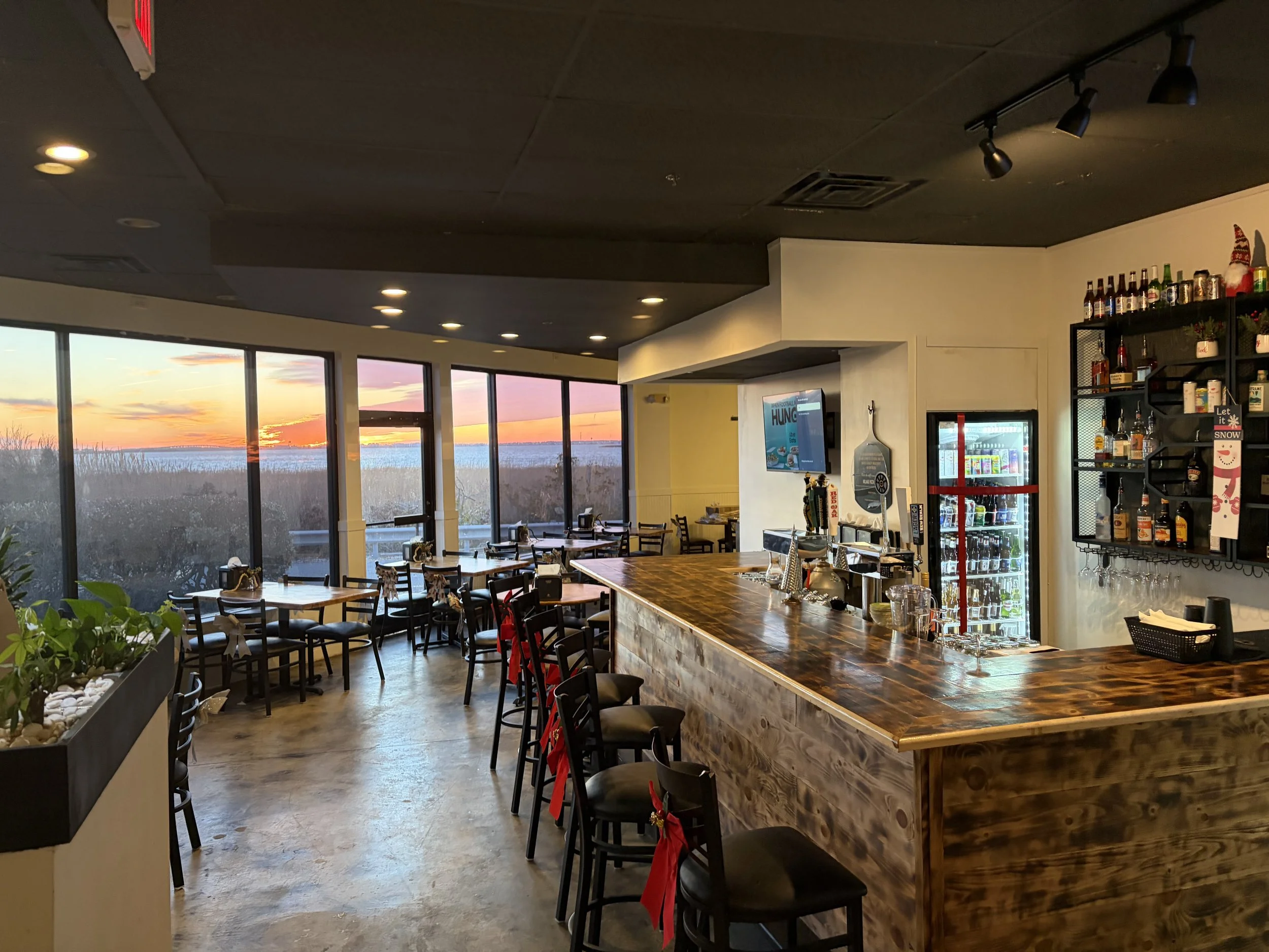 Village Pizza Nags Head full bar and dining room with sunset view