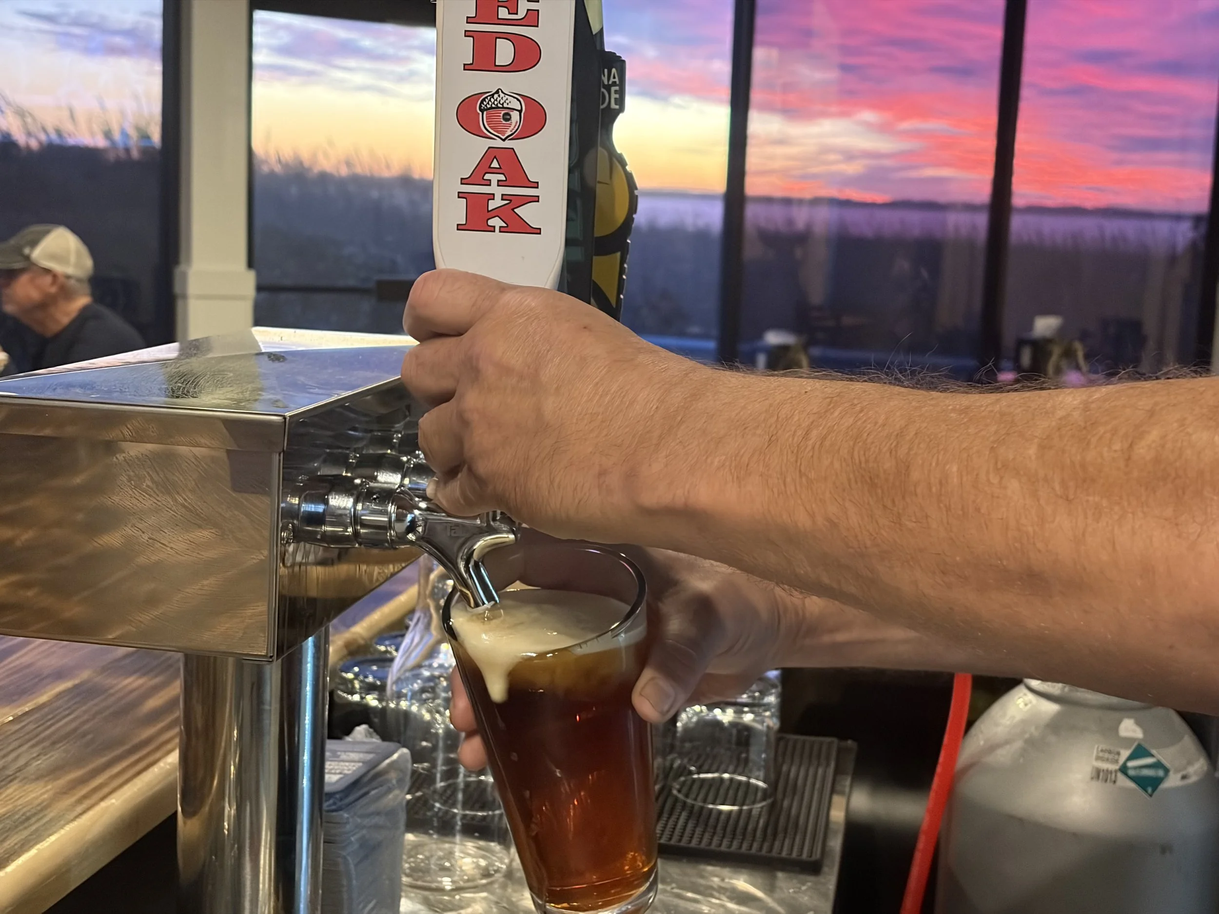 Draft beer pour at Village Pizza Nags Head NC bar