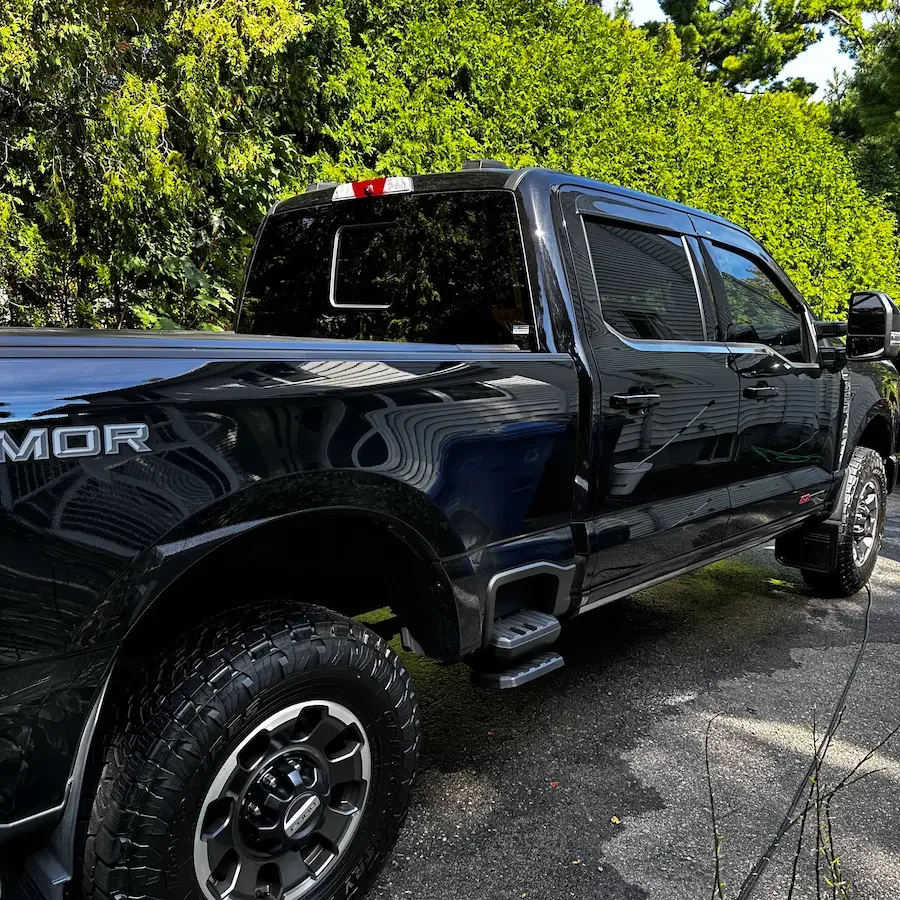 A black Ford F-150 pickup truck