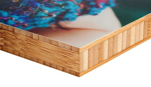 Close-up of a wooden canvas stretching frame with a printed image of colorful abstract art.