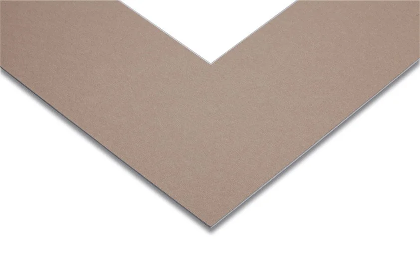 Close-up of a corner of a brown cardboard sheet.