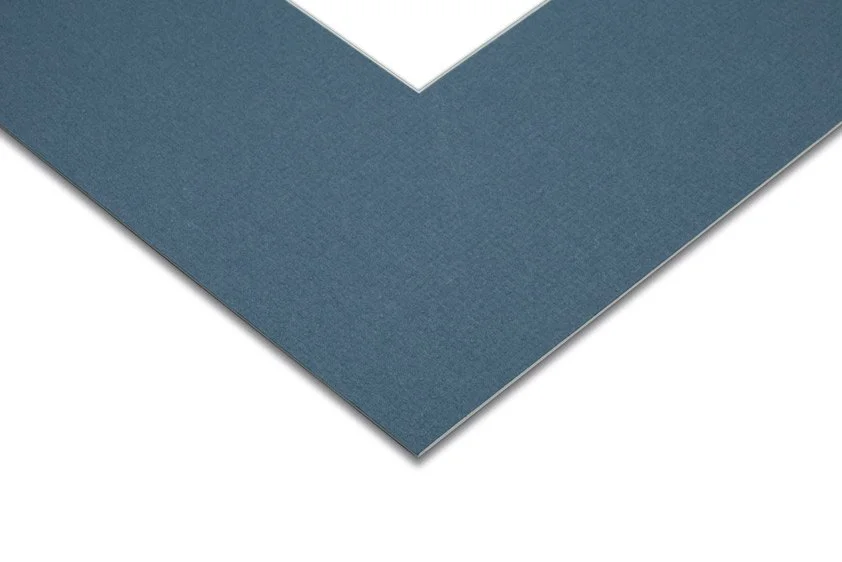 Close-up of a blue greeting card with a white interior corner visible.