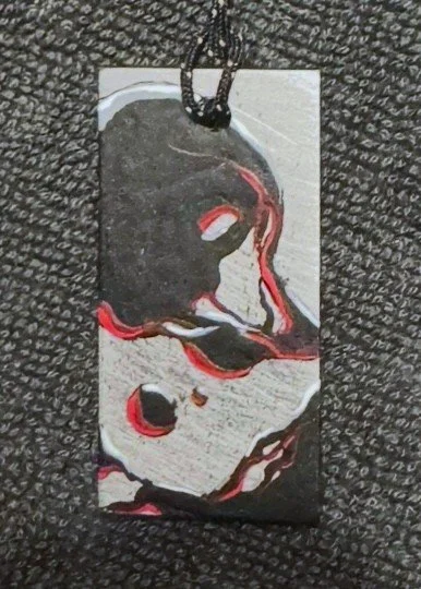 Black and white logo featuring a circular gauge with a fuel pump icon inside.