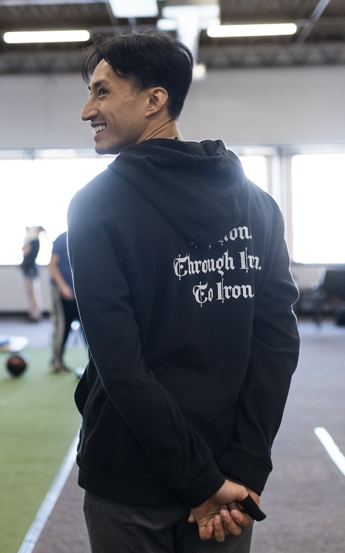 Frank Chen coaching in a gym and building a fitness community through group and personal training