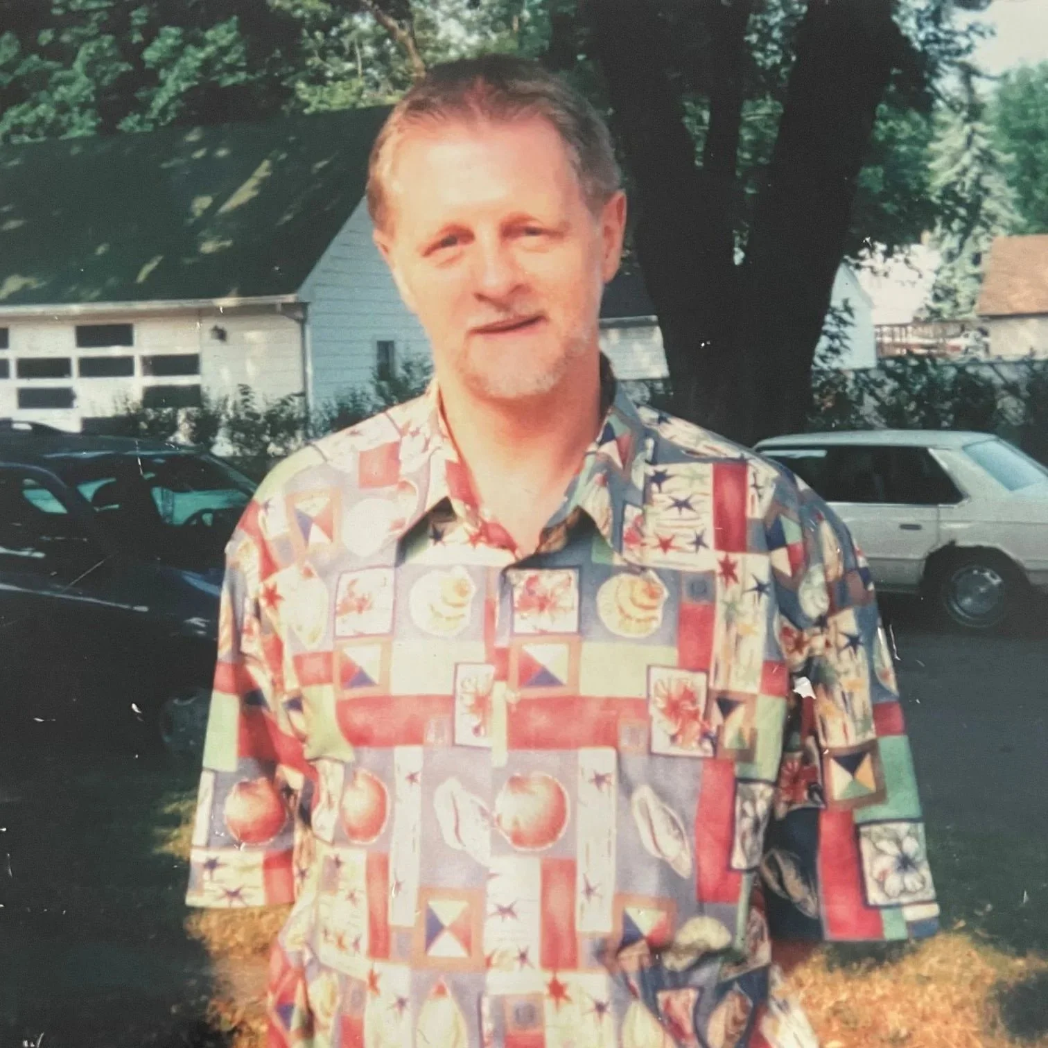 My father posing for a pic in front of his sister's house. He was happy to have visited with her.