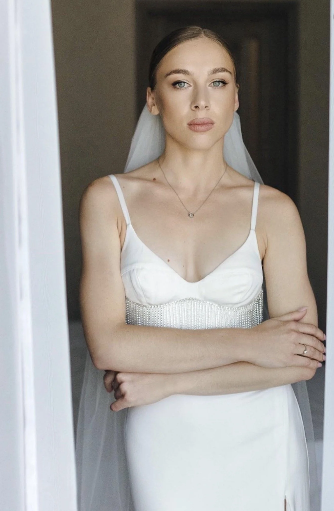 Minimal studio bridal look with clean, modern wedding makeup and smooth skin finish