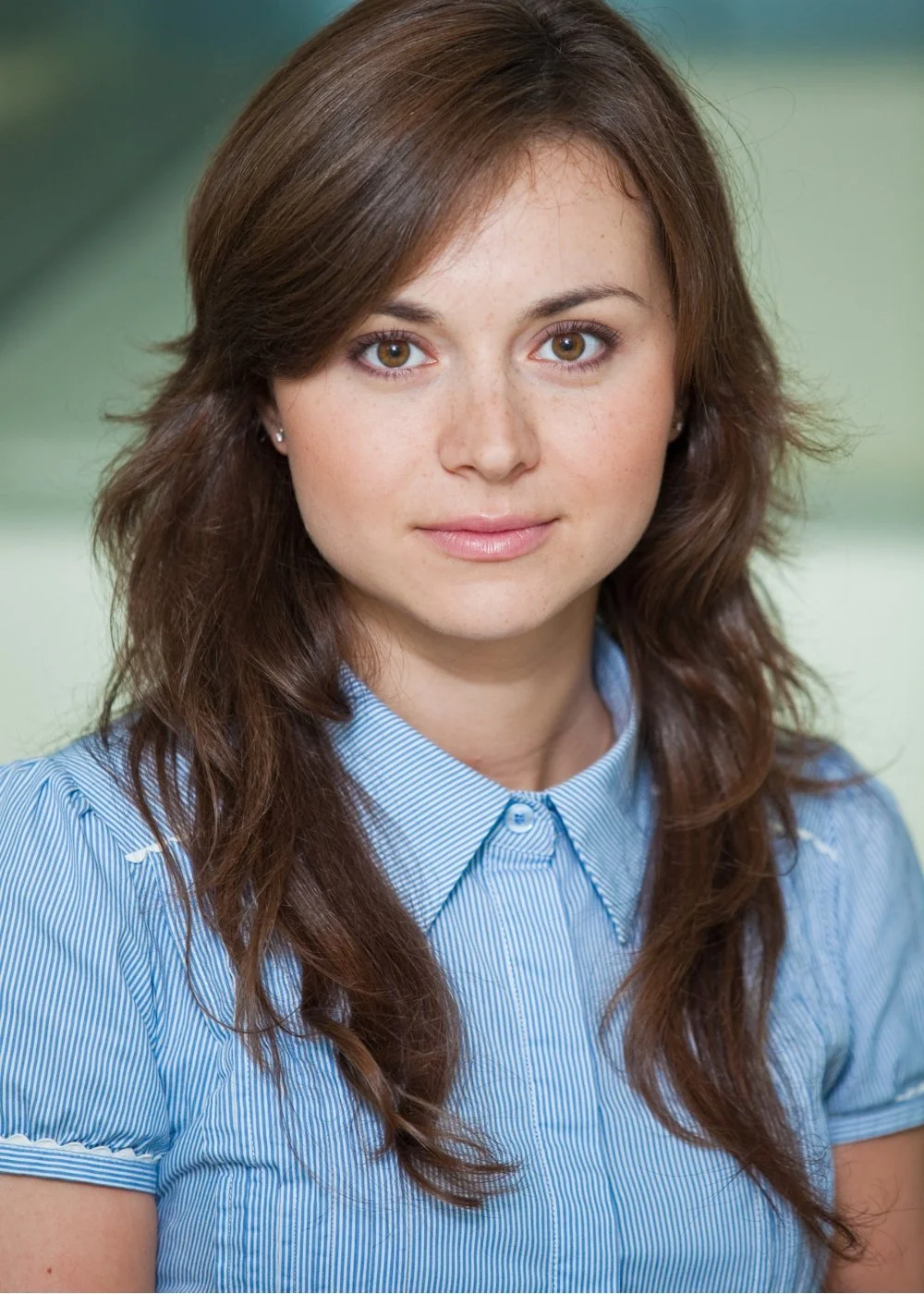 Natural makeup headshot with soft blush and defined brows