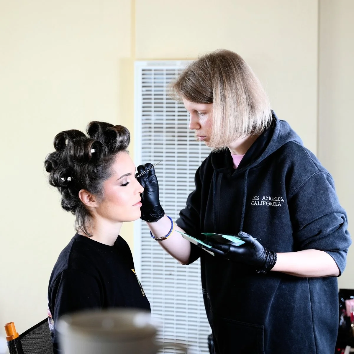 Professional makeup application for a client on-location