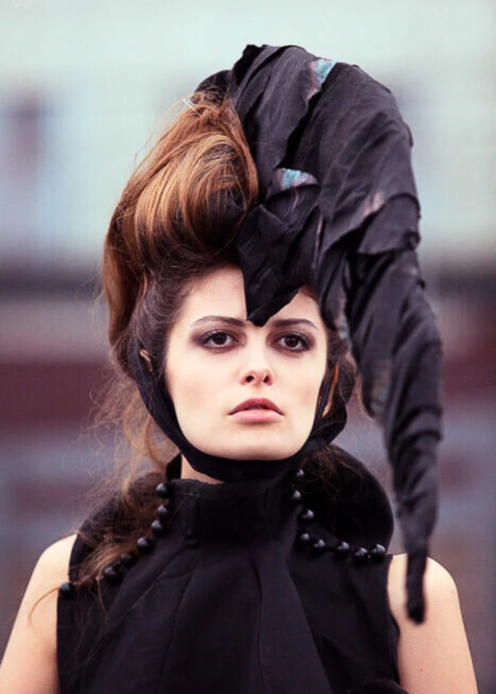 High-fashion beauty makeup for an editorial shoot — sculpted complexion and dramatic styling