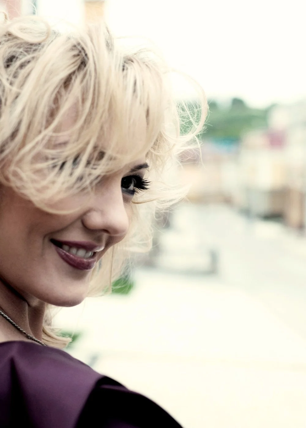 Candid blonde portrait with natural makeup and soft pink lip