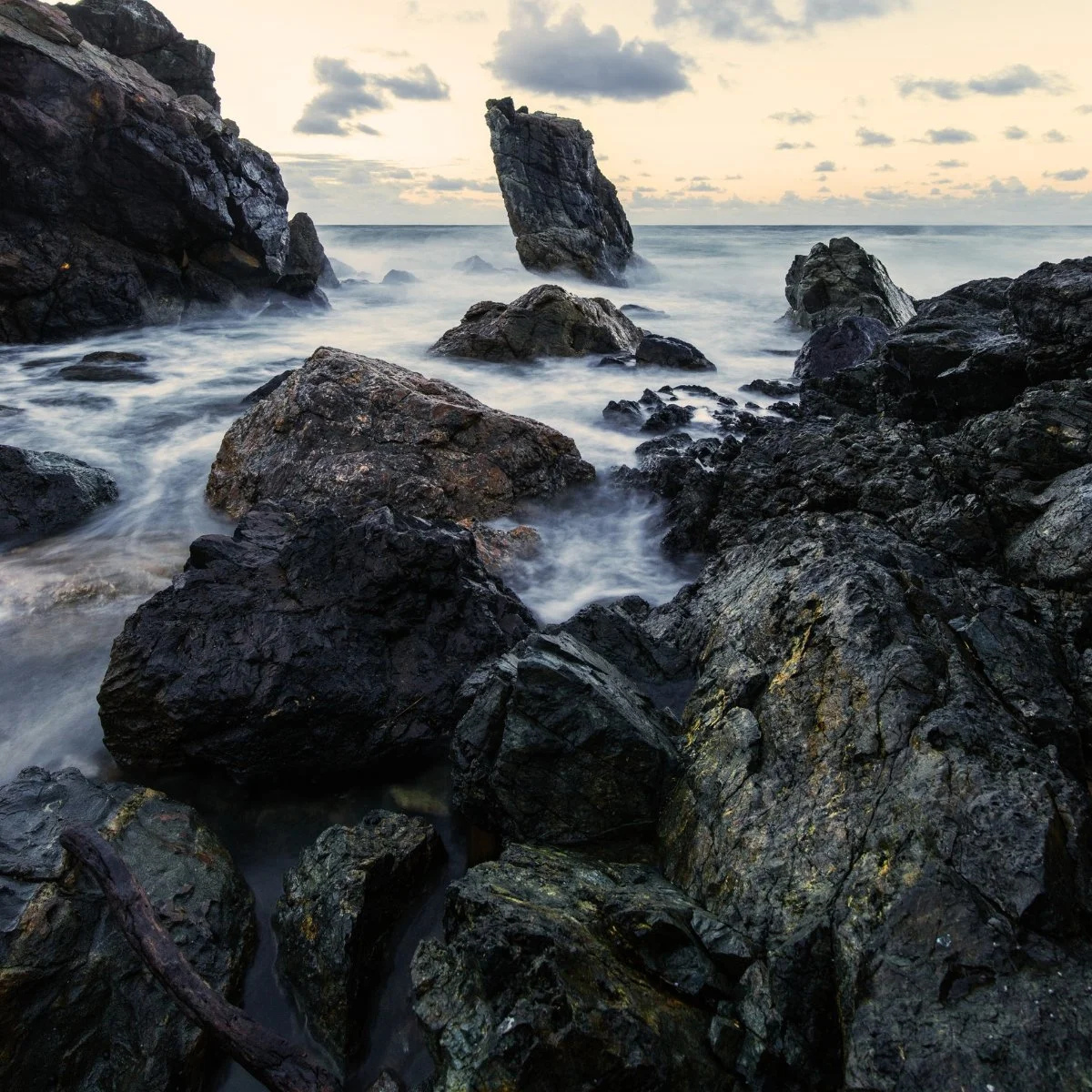 Rocky Pacific Ocean coastline at sunset