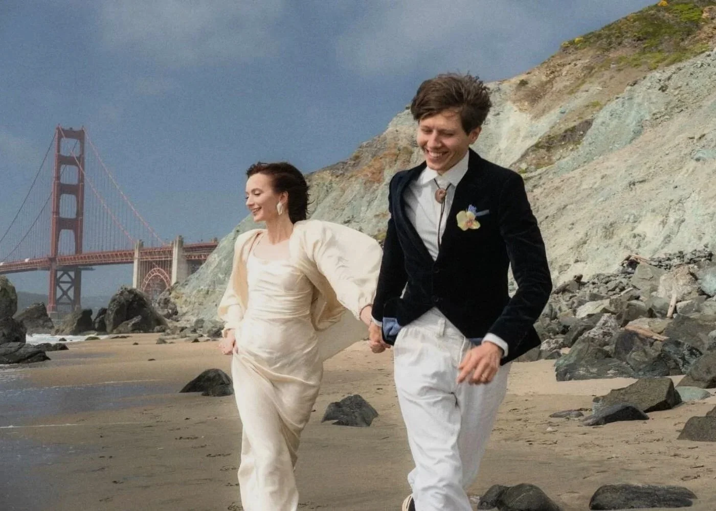 Couple on the beach near the Golden Gate Bridge with natural, camera-ready makeup