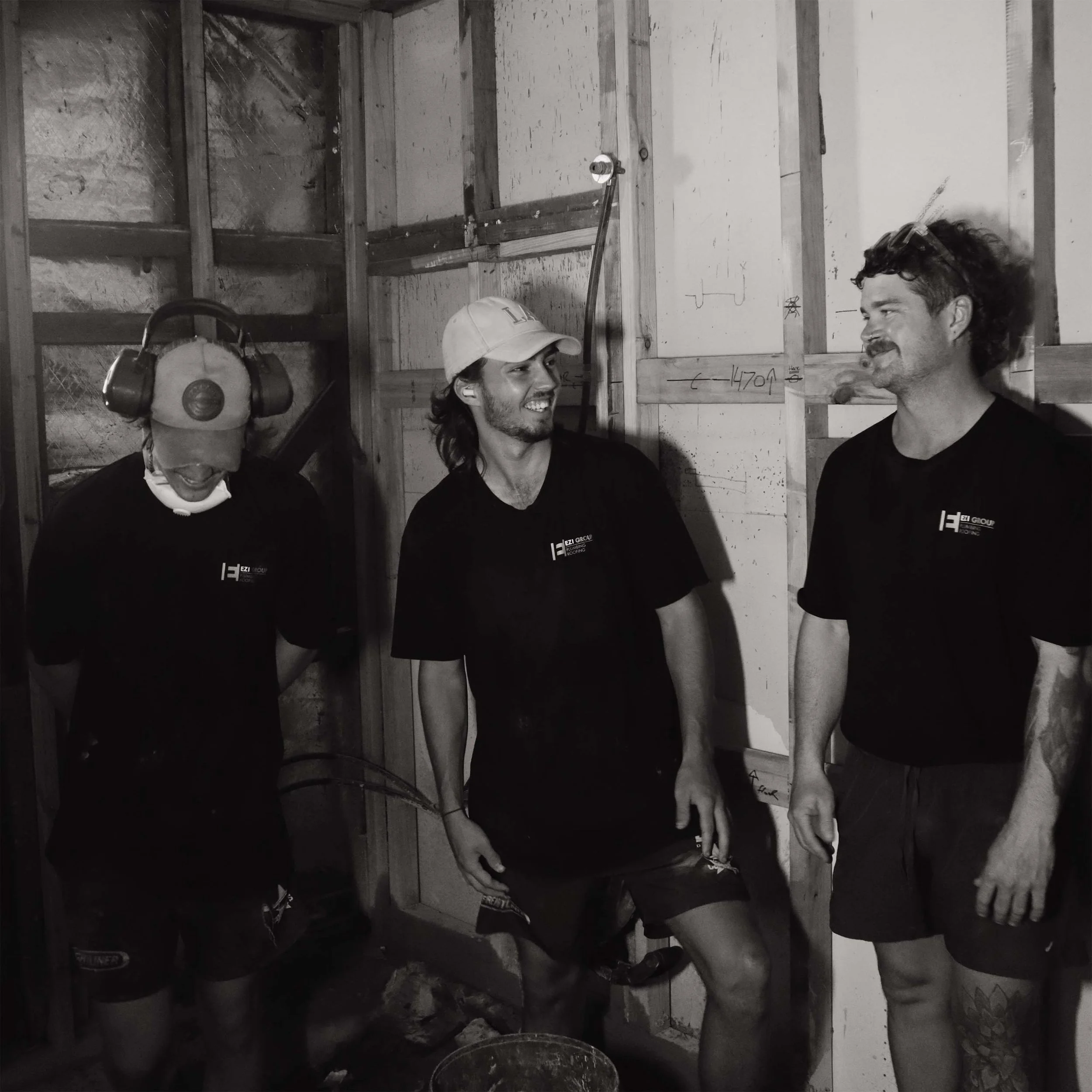 A photo of Michael and our apprentices from Ezi Group smiling while working.