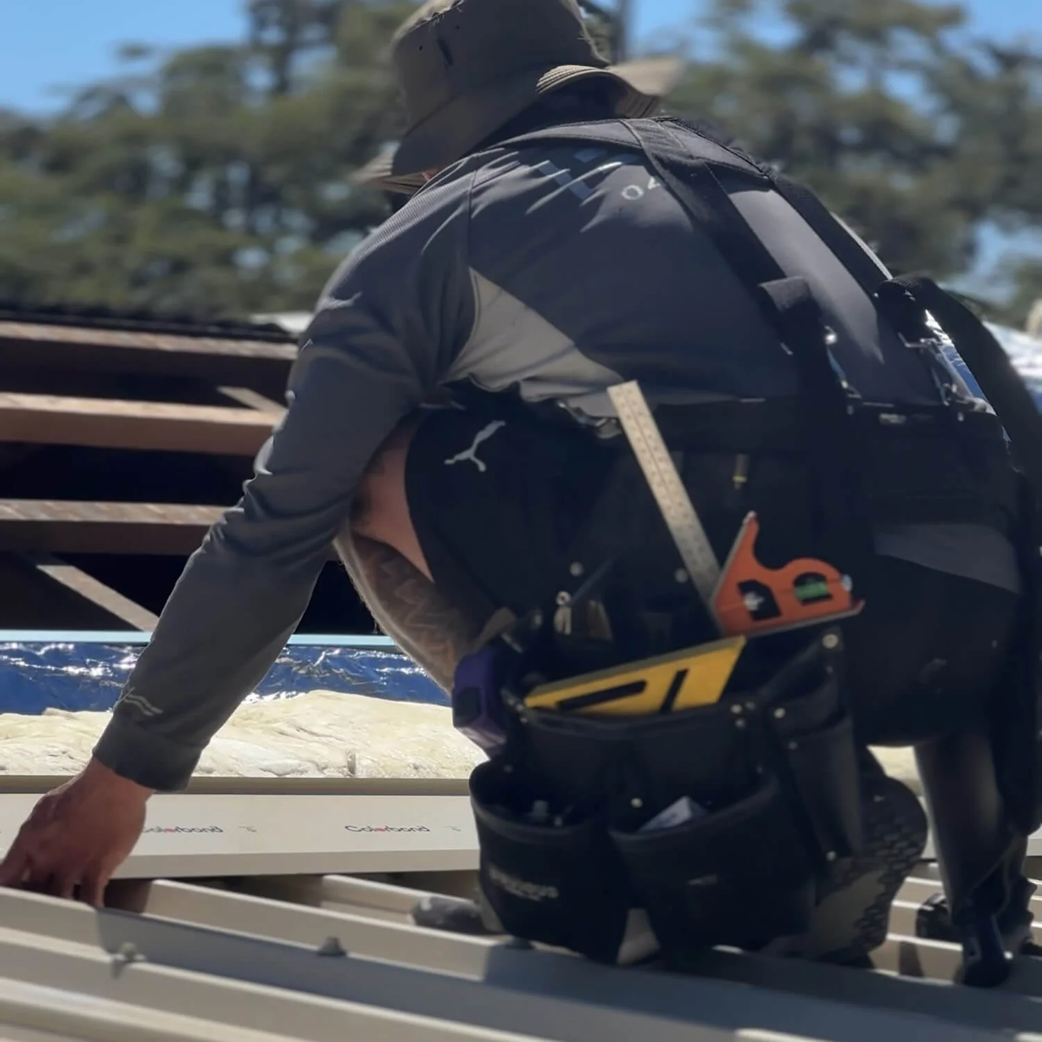 A photo of Michael from Ezi Group working on a customer's roof.